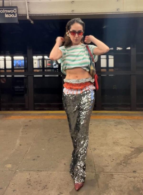Kristina Avakyan, a bartender from the Lower East Side, posing in her viral fashions on a subway platform.