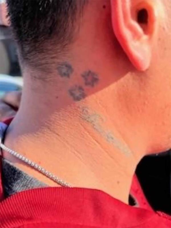 Other tattoos with three five-pointed stars, a sign of Tren de Aragua.