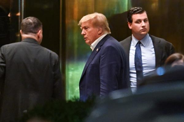 Former President Do<em></em>nald Trump is seen arriving at Trump Tower Sunday night.