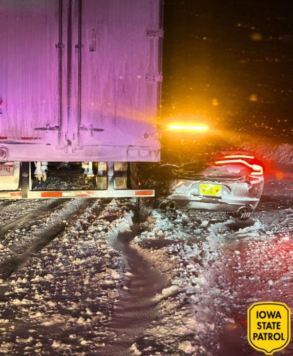 A semi truck crashed into a state trooper car.