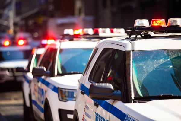New York NYPD Police car with sirens at day on street