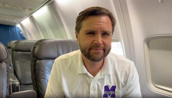 J.D. Vance sitting in a chair discussing Kamala Harris on Trump Force Two