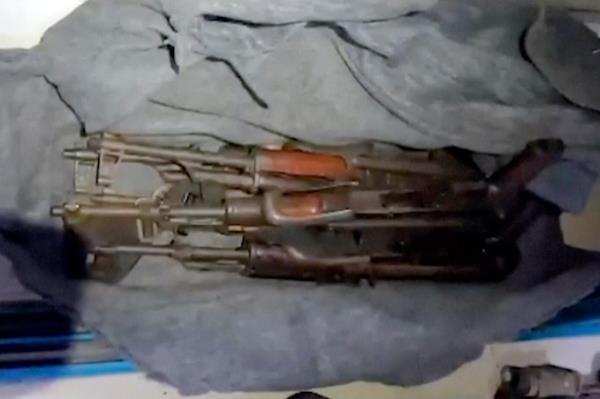 This image taken from a video released by the Israeli Defense Forces, Wednesday, Nov. 15, 2023, shows a cache of weapons the IDF says were found in a closet at the MRI center at Al Shifa hospital
