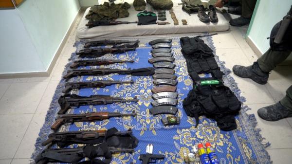 Weapons and equipment which Israel's army says it found at Al Shifa hospital complex in the Gaza Strip, as seen in a handout picture released by the Israel Defense Forces on November 15