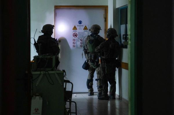This handout picture released by the Israeli army on November 15, 2023, reportedly shows Israeli soldiers carrying out operations inside Al-Shifa hospital