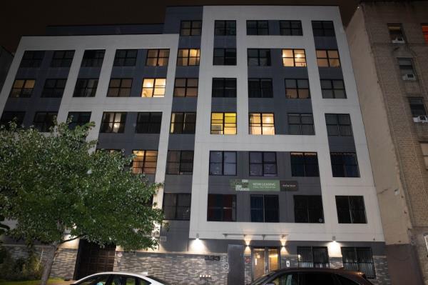 The 1-year-old tumbled out an unsecured window at the apartment building.
