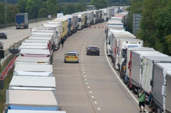 ? Licensed to Lo<em></em>ndon News Pictures 08/09/2023. Ashford, UK. Queuing freight traffic is held at junction 9 for Ashford in Kent. The M20 in Kent between junction 8 and junction 9 is closed for a second day as the search co<em></em>ntinues for escaped priso<em></em>ner Daniel Abed Khalife age 21 who broke out of Wandsworth prison. Photo credit: Grant?Falvey/LNP