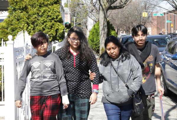Guadalupe Arroyo walking with her children and a friend to a memorial for her 8-year-old son Bayron, who was killed crossing the street in Queens.