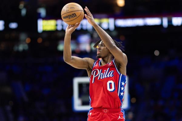  Philadelphia, Pennsylvania, USA; Philadelphia 76ers guard Tyrese Maxey (0) shoots against the New York Knicks during the first half of game four of the first round in the 2024 NBA playoffs at Wells Fargo Center.