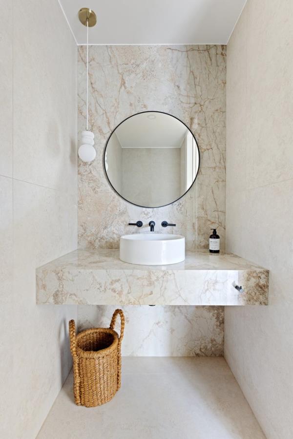 Stunning stone anchors this bathroom.