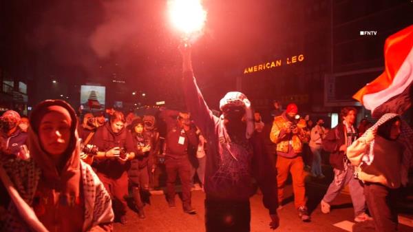 Video shows protester with flares marching toward NYPD HQ as over 150 arrested at NYU 