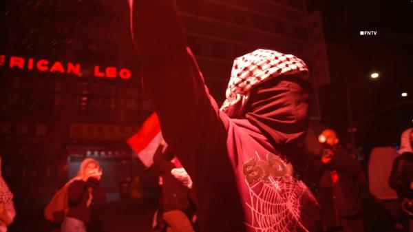 Video shows protester with flares marching toward NYPD HQ as over 150 arrested at NYU 