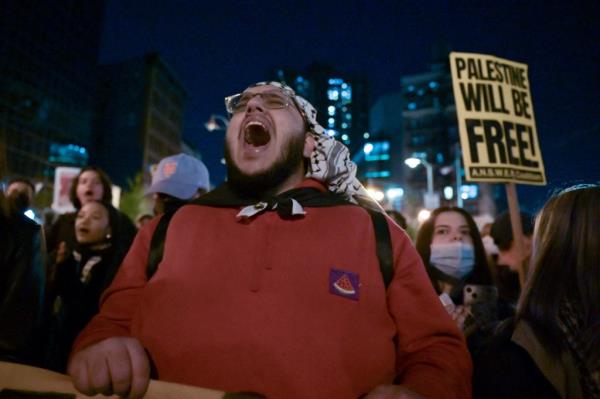 Protesters chant near city hall after attending an occupation at New York University