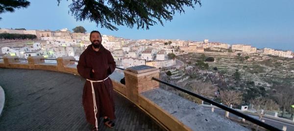 Shia LaBeouf, wearing a friar's habit, stands in Mo<em></em>nte Sant'Angelo, Italy.