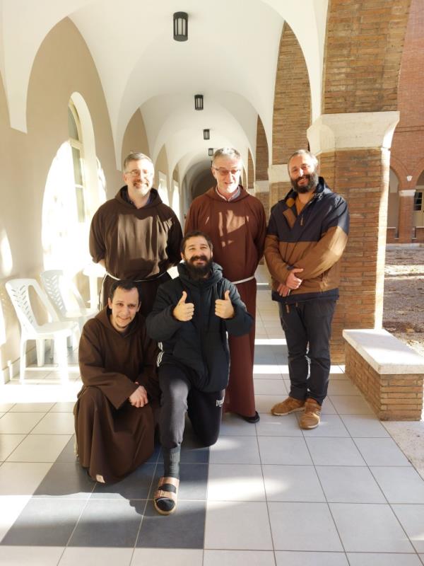Shia LaBeouf gives two thumbs up while posing with friars.