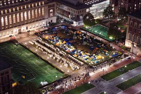 NYPD officers surround the pro-Palestinian encampment on the lawn of Columbia University on Tuesday.