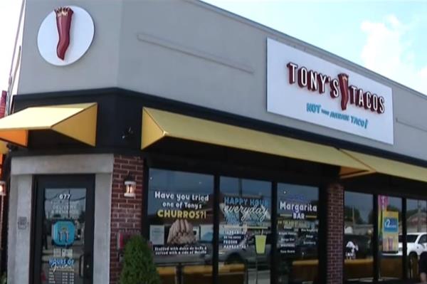 Image of the eatery, Tony's Tacos. An image of a chili pepper is on the front of the establishment, and a sign reading