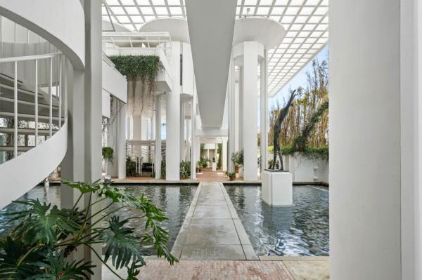 A courtyard has a reflecting pool.