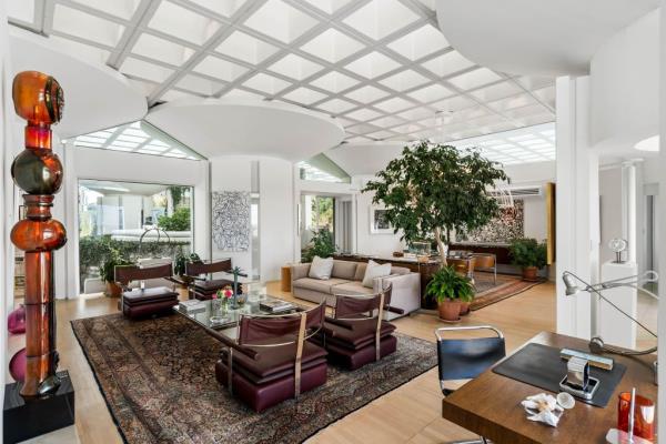 A sitting area under a grid-patterned ceiling.