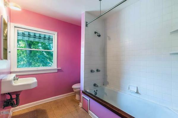 The bathroom currently decorated in pink.