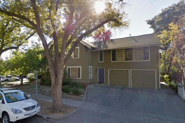 Side view of the home showing its two garages.
