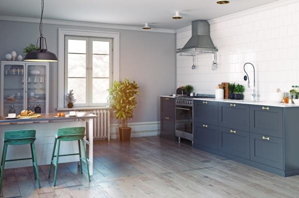 Modern kitchen with green chairs and range hood
