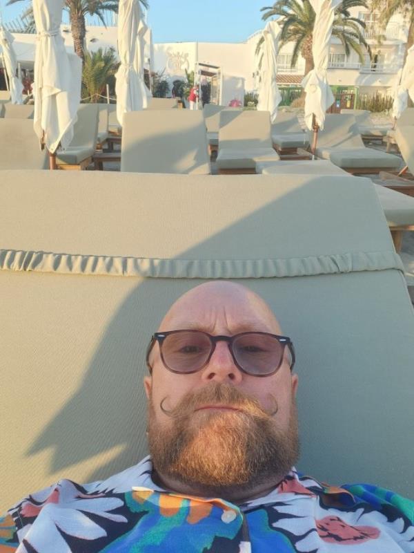 Andy Armstrong on the sunbeds in Ibiza.