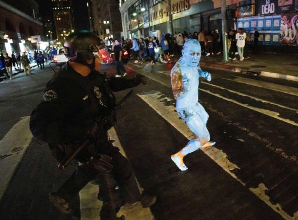 The blue man appeared to evade cops as they closed in on him, though it is unknown if he was later detained