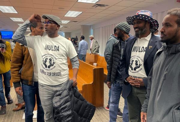 Ride-hailing drivers celebrate in Minneapolis on Thursday.