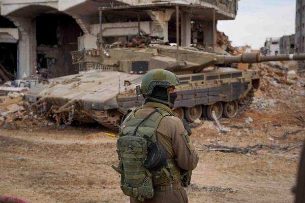 An Israeli soldier looks on as they operate in the Gaza Strip, after a temporary truce between Israel and the Palestinian Islamist group Hamas expired, in this handout picture released on December 1, 2023.