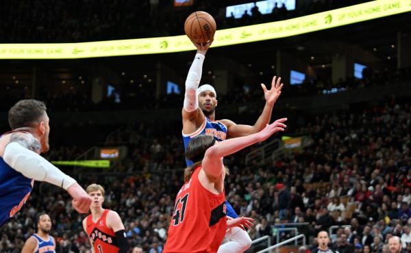 Knicks forward Josh Hart (3) shoots the ball over Toro<em></em>nto Raptors forward Kelly Olynyk (41) in the first half at Scotiabank Arena.