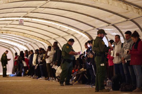 Migrants surrendering to Border Patrol agents after crossing the border near Yuma, Arizona on June 5, 2023.