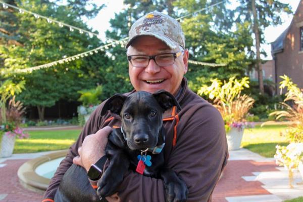 Gov. Tim Walz is pictured with his dog Scout.