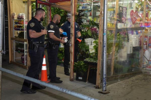 Police working at the scene of the shooting in which a 4-year-old boy was injured.