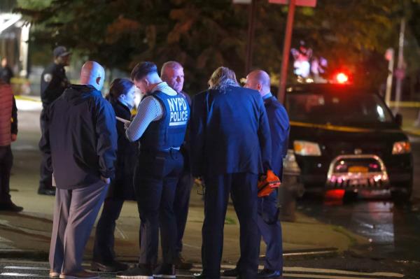 Detectives gathered at the crime scene.