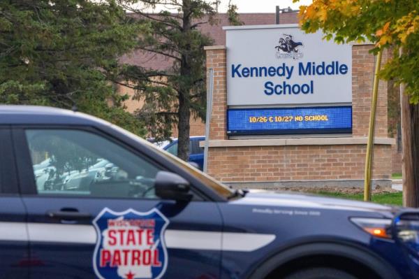 A Wisco<em></em>nsin State trooper vehicle is pictured parked outside of Kennedy Middle School.