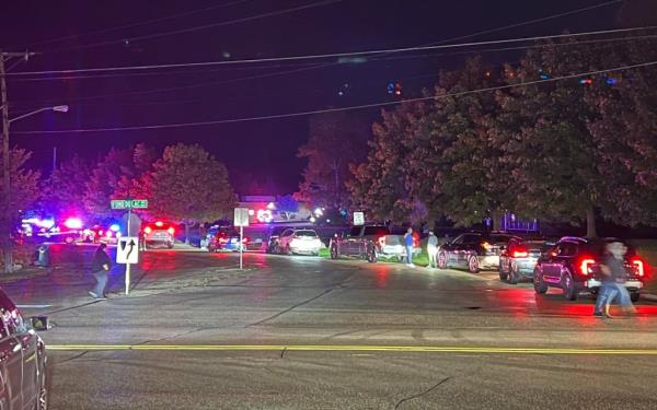 Police vehicles are pictured lined up outside the school Mo<em></em>nday night.