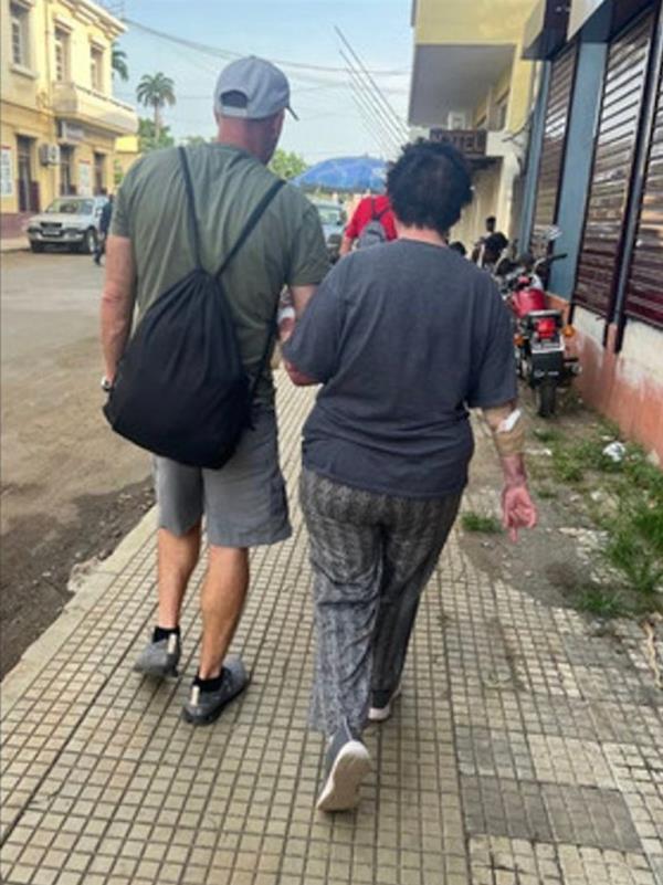 Jay Campbell was seen escorting Lenkoff through the streets of the Central African island.