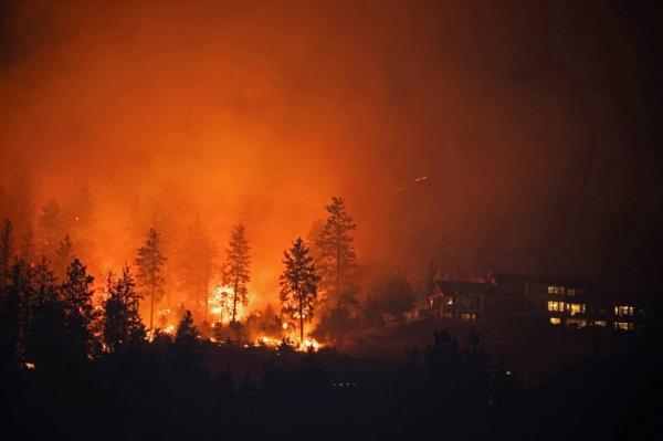 The fire is centered around Kelowna, a city some 180 miles east of Vancouver, with a population of a<em></em>bout 150,000.