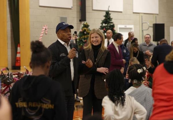 Mayor Eric Adams and NYPD Commissio<em></em>ner Jessica Tisch giving speeches the Police Athletic League's holiday party in Harlem