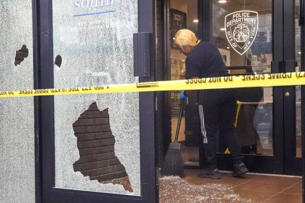 A photo of the shattered station house window on West 35th Street near Ninth Avenue