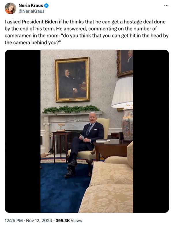 President Joe Biden sitting in a chair respo<em></em>nding to a question from reporter Neria Kraus