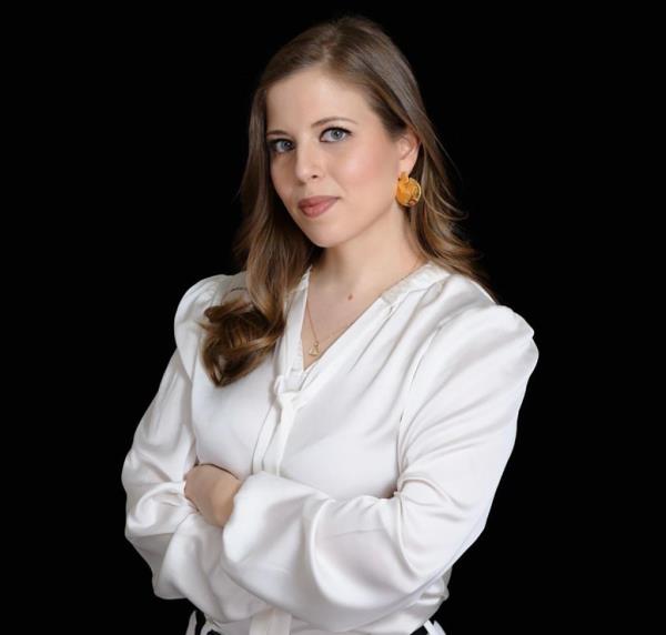 Journalist Neria Kraus with her arms crossed