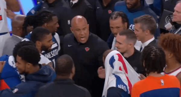 Rick Brunson yells back at Do<em></em>nte DiVincenzo, who has a towel over his head.
