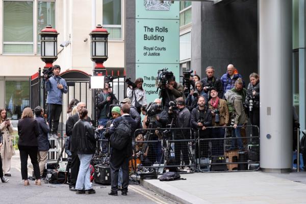 Members of the press wait for the Mirror Group Phone hacking trial at the Rolls Building at High Court.