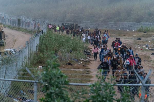 Migrants, mostly from Venezuela, attempt to cross into the US from Mexico in Eagle Pass, TX in late December 2023.