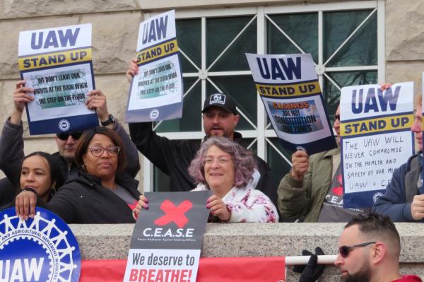 Atlantic City casino workers hold signs during a rally in Trenton, N.J., on April 5.
