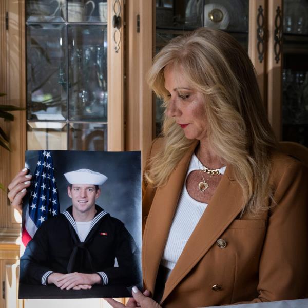 Regina Mullen holding a picture of her deceased son, Kyle Mullen, at her home in Manalapan, New Jersey