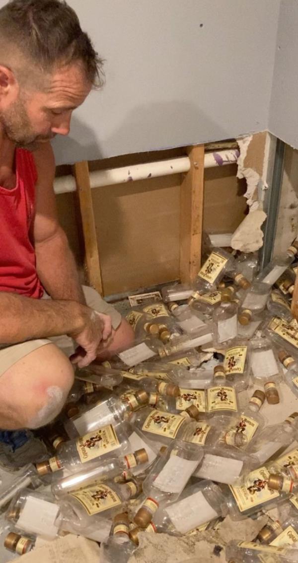 Rum bottles coming out of wall
