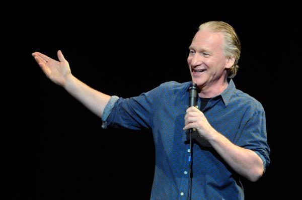 Bill Maher speaking into a microphone